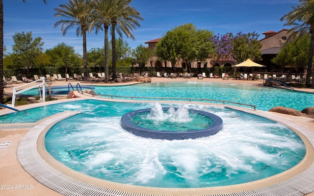 view of swimming pool featuring pool water feature