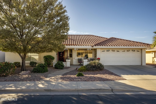 view of front of home with a porch and a garage