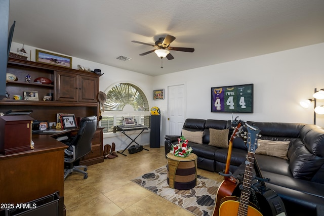 home office featuring light tile patterned floors, a textured ceiling, and ceiling fan