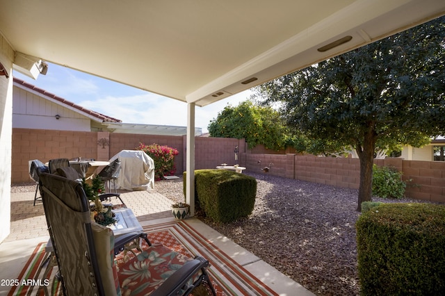 view of patio featuring a grill