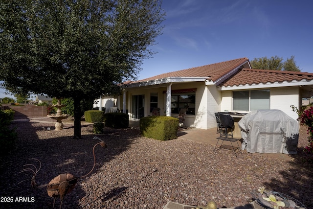 back of house featuring a patio area