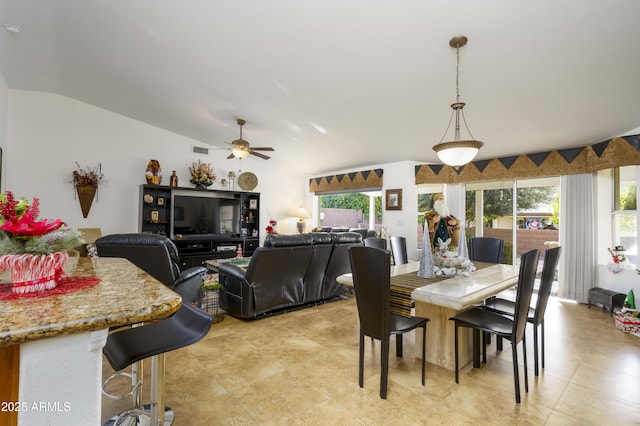 dining room with vaulted ceiling and ceiling fan