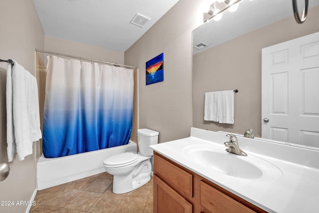 full bathroom featuring shower / bathtub combination with curtain, tile patterned flooring, vanity, and toilet