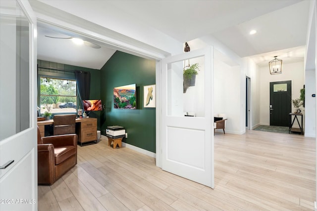 interior space featuring vaulted ceiling, recessed lighting, light wood-type flooring, and baseboards