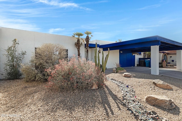 exterior space with a carport