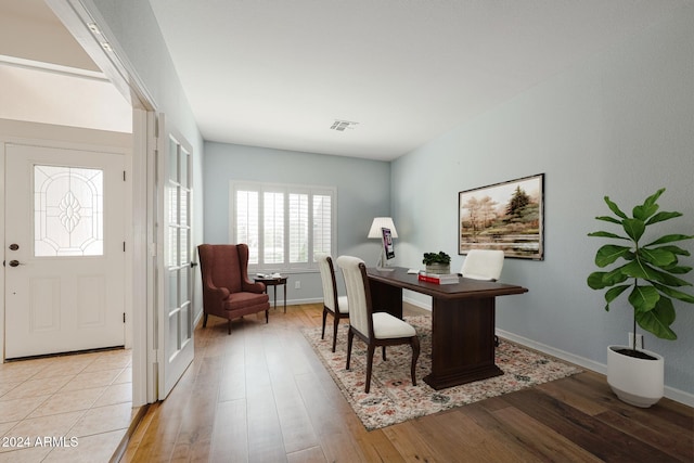 office with light hardwood / wood-style floors