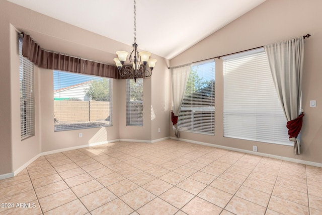 unfurnished dining area with a notable chandelier, a healthy amount of sunlight, light tile patterned flooring, and lofted ceiling