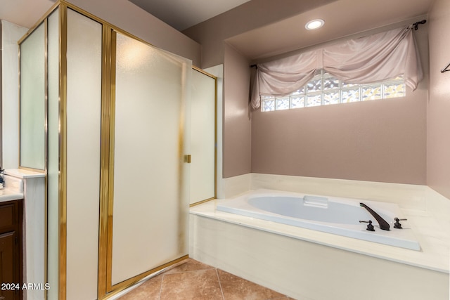 bathroom featuring vanity, tile patterned floors, and independent shower and bath