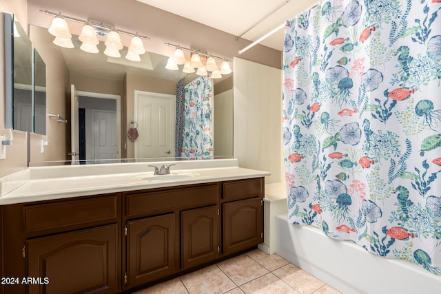 bathroom with tile patterned floors, vanity, and shower / tub combo with curtain