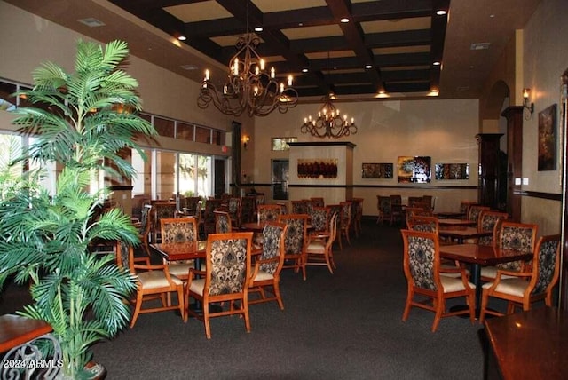 dining space with carpet flooring, a notable chandelier, beam ceiling, and coffered ceiling