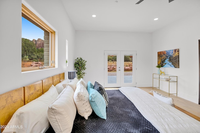 bedroom featuring recessed lighting, french doors, wood finished floors, and access to exterior