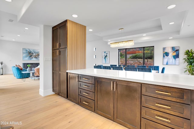 kitchen with light countertops, recessed lighting, and light wood-type flooring