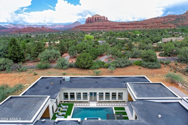 drone / aerial view featuring a mountain view