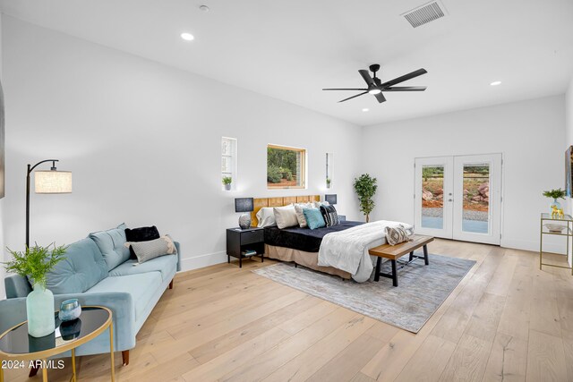 bedroom with light wood-type flooring, visible vents, access to exterior, and french doors