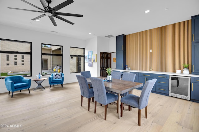 dining room featuring a ceiling fan, beverage cooler, visible vents, light wood finished floors, and recessed lighting