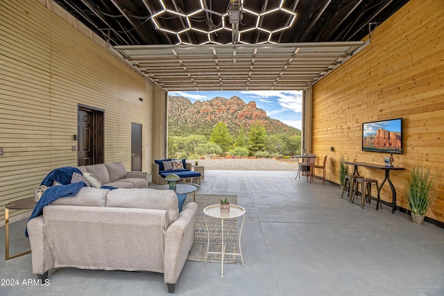 view of patio featuring an outdoor living space and a pergola