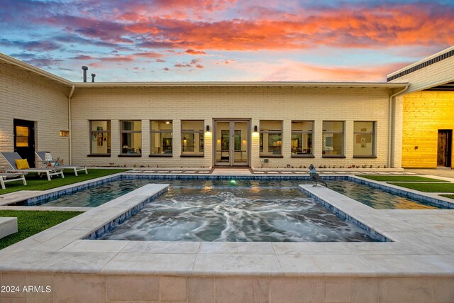 pool with an in ground hot tub, a pergola, and a patio