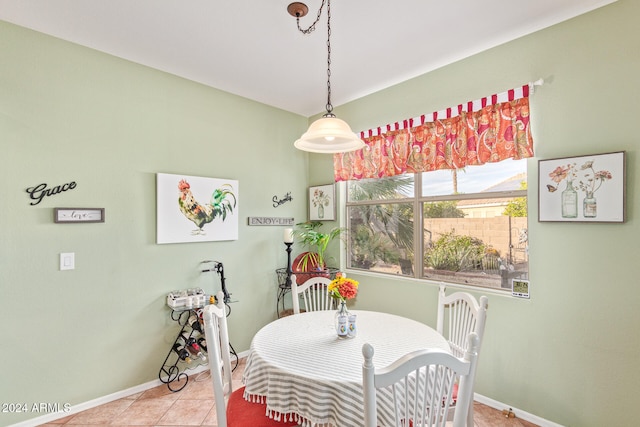 dining area with light tile patterned flooring