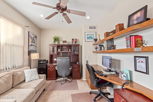 carpeted office featuring ceiling fan