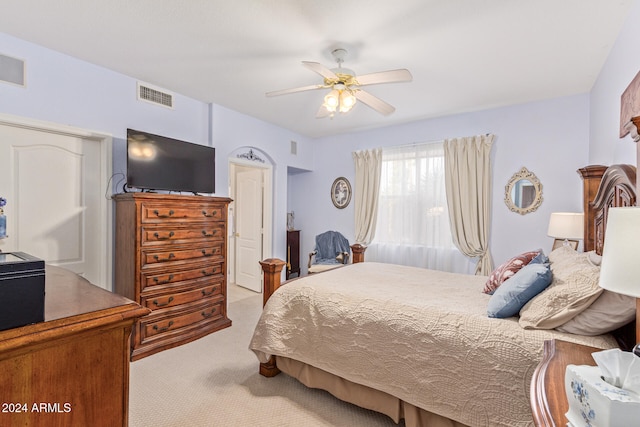 bedroom featuring light carpet and ceiling fan