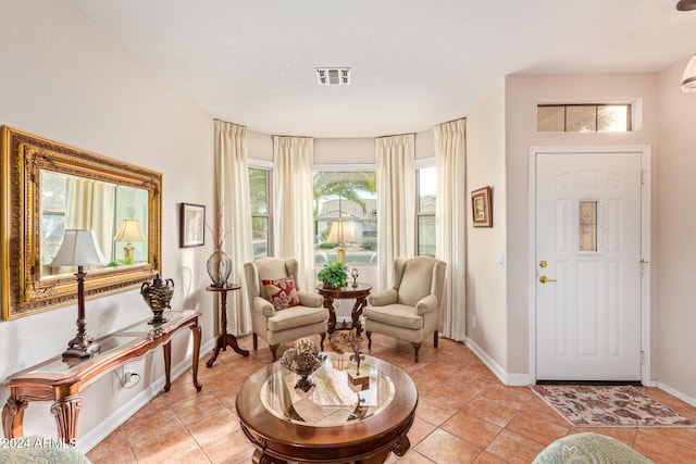 living area featuring light tile patterned flooring