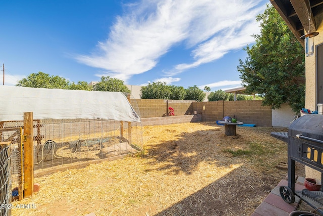 view of yard with a fenced backyard