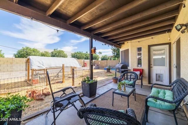 view of patio featuring an outdoor hangout area, area for grilling, and a fenced backyard