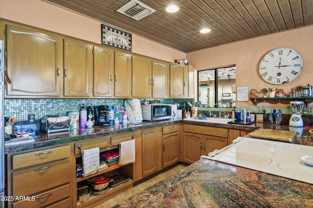 kitchen with decorative backsplash, wood ceiling, and sink