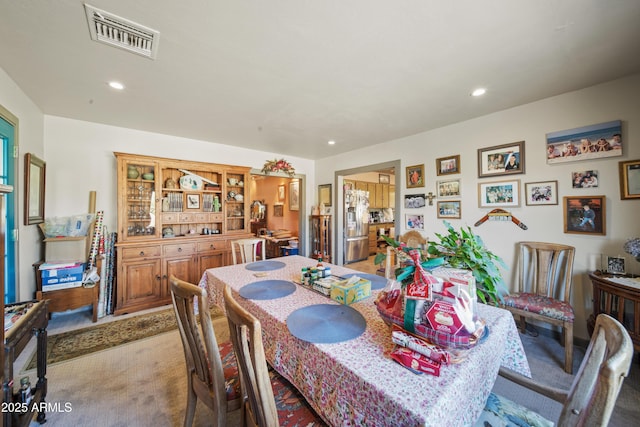 dining area with light colored carpet