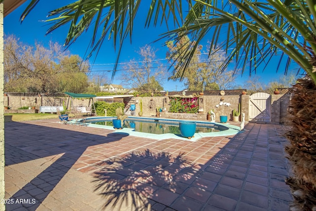 view of swimming pool featuring a patio area