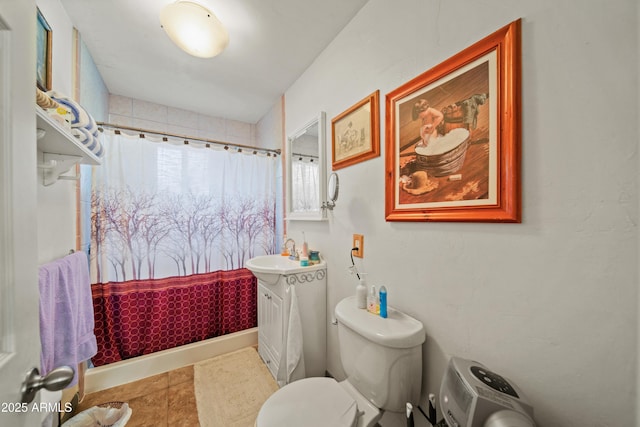 bathroom with tile patterned floors, vanity, a shower with shower curtain, and toilet