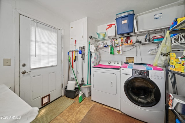 laundry room with washing machine and clothes dryer