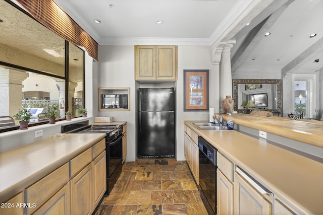 kitchen featuring butcher block counters, sink, light brown cabinets, decorative columns, and black appliances