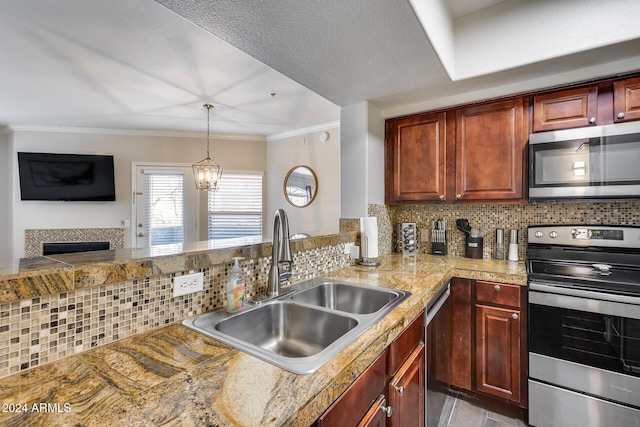 kitchen with a notable chandelier, sink, appliances with stainless steel finishes, and tasteful backsplash