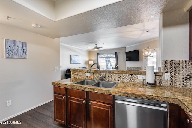 kitchen featuring decorative backsplash, kitchen peninsula, ceiling fan with notable chandelier, sink, and dishwasher