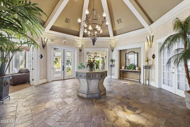 foyer entrance with beam ceiling, french doors, high vaulted ceiling, and plenty of natural light