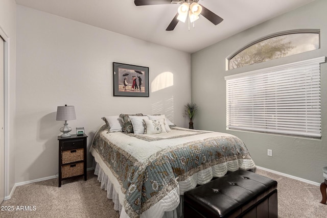 bedroom with ceiling fan and carpet floors