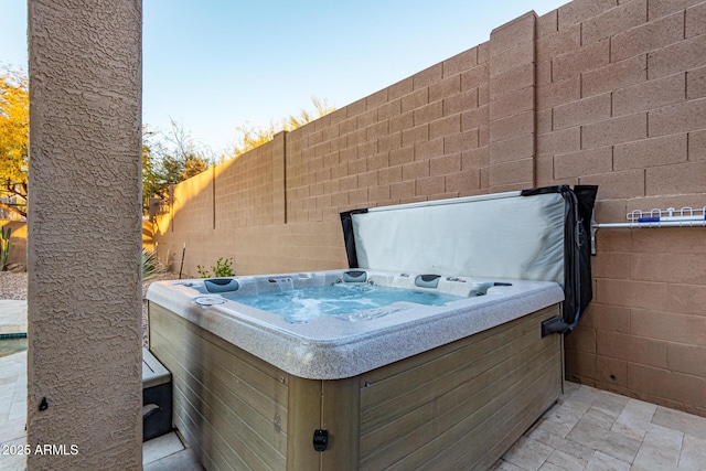 view of patio / terrace featuring a hot tub