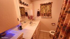 bathroom featuring tile patterned flooring, vanity, and toilet