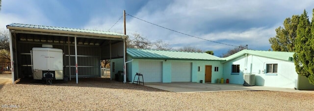 back of house featuring cooling unit