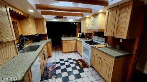 kitchen featuring white appliances and sink