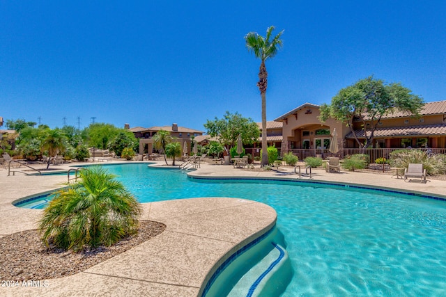 view of swimming pool with a patio