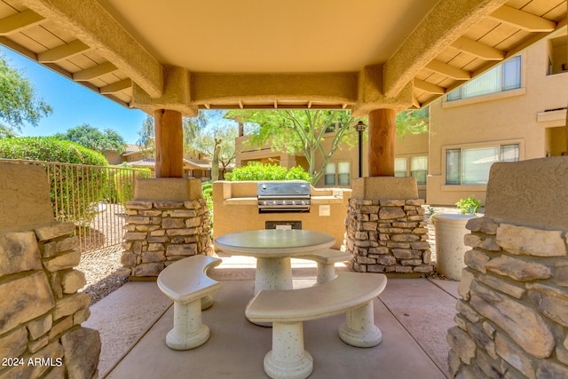 view of terrace with a grill and area for grilling