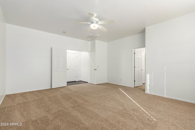 carpeted empty room with ceiling fan