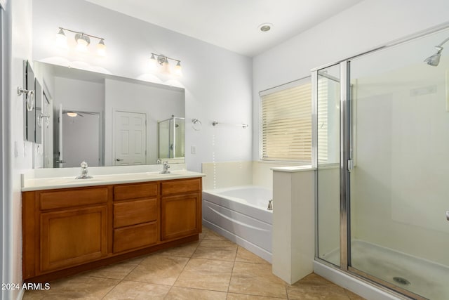 bathroom with vanity, tile patterned floors, and independent shower and bath