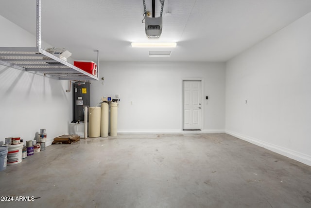 garage with electric water heater and a garage door opener