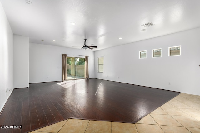 empty room featuring ceiling fan and light wood-type flooring