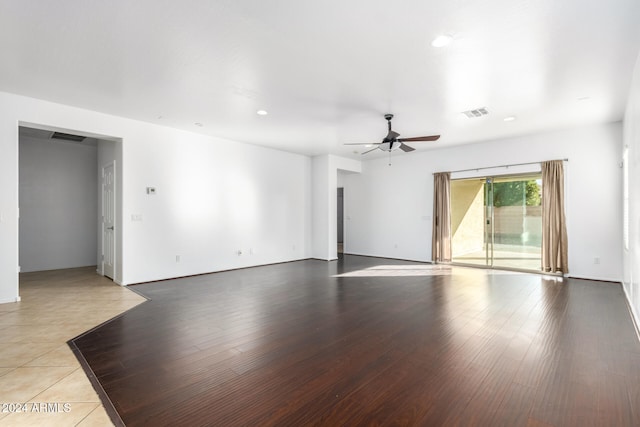 unfurnished room with ceiling fan and light hardwood / wood-style flooring