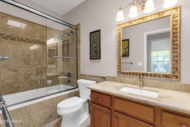 11775 E Becker Ln, Scottsdale, AZ 85259 - bathroom featuring toilet, tiled shower / bath, vanity, and tile walls
