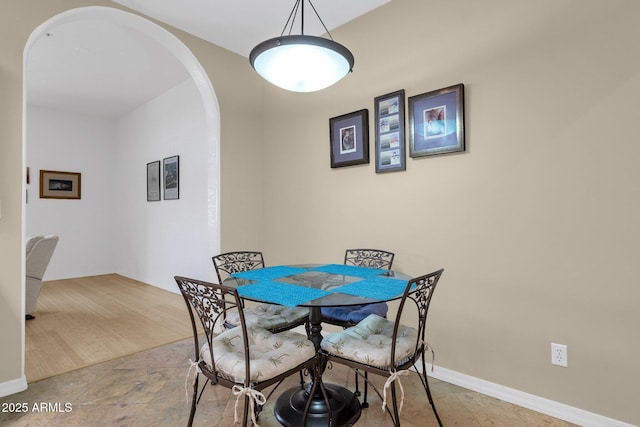 11775 E Becker Ln, Scottsdale, AZ 85259 - dining space featuring arched walkways and baseboards
